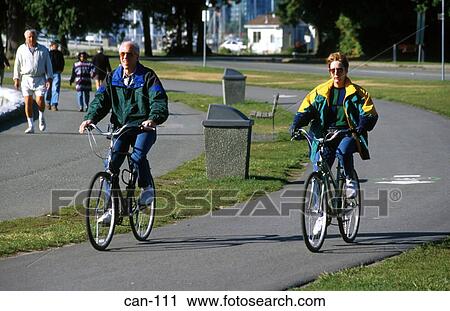 Two Cyclists on Cycle Path Vancouver Canada View Large Photo Image Stock Image - Two Cyclists on Cycle Path Vancouver Canada. Fotosearch