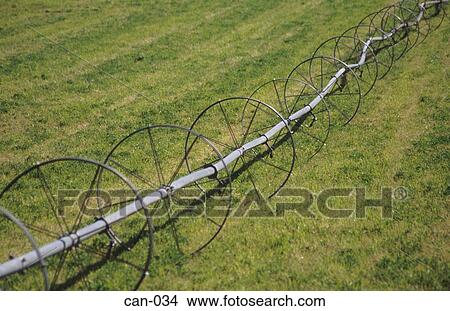 Picture - Wheeled Irrigation Pipe Canada. Fotosearch