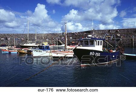 Stock Photograph - Fishing Boats Mousehole Harbour Cornwall England. Fotosearch