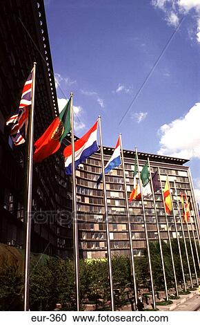 Stock Image - Flags outside European Union Building Brussels. Fotosearch