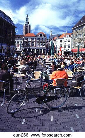 People in an Outside Cafe Schoolstr the Hague NL View Large Photo Image Stock Photograph - People in an Outside Cafe Schoolstr the Hague NL. Fotosearch