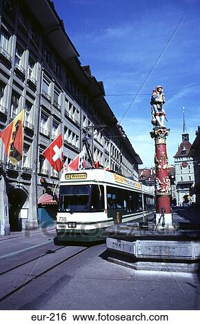 Stock Photograph - Piper Fountain & Tram Spital Gasse Bern Switzerland. Fotosearch