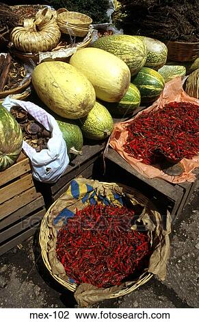 Stock Image - Baskets of Chillies and other Produce Mexico. Fotosearch