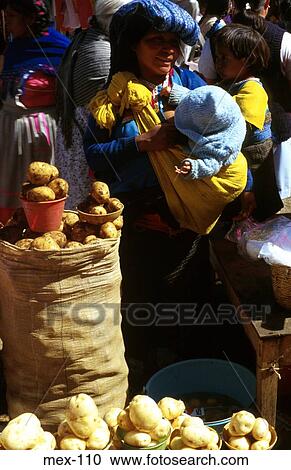 Mexican Woman Carrying Baby at Market Stall View Large Photo Image Stock Image - Mexican Woman Carrying Baby at Market Stall. Fotosearch