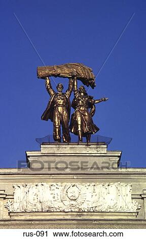 Golden Statue of Farm Workers Holding Crops Vdnkh View Large Photo Image Stock Image - Golden Statue of Farm Workers Holding Crops Vdnkh. Fotosearch
