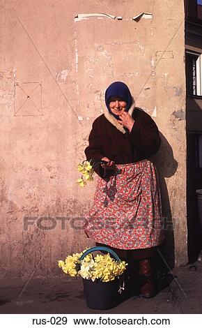 Stock Photo - Old Woman Selling Flowers St Petersburg. Fotosearch