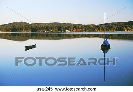 Boats and Landscape Reflected in Spofford Lake USA View Large Photo Image Stock Photography - Boats and Landscape Reflected in Spofford Lake USA. Fotosearch