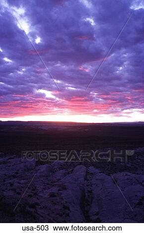 Stock Image - Clouds and Sunset over Desert Page Arizona. Fotosearch
