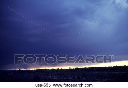 Stock Photography - Clouds in the Arizona Desert at Dusk. Fotosearch