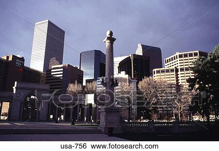 Stock Photograph - Column in park with Office Blocks in Background. Fotosearch