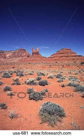 Stock Image - Desert With Rock Formations on Horizon Arizona. Fotosearch