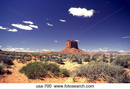 Stock Image - Desert With Rock Formations on Horizon Arizona. Fotosearch