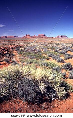 Stock Photo - Desert With Rock Formations on Horizon Arizona. Fotosearch