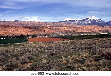 Stock Image - Farmland With Rockies on Horizon Utah. Fotosearch