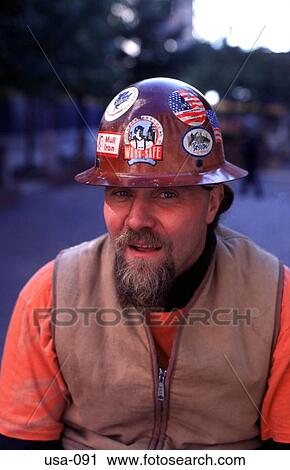 Stock Image - Labourer Wearing Steel Hat and Stickers USA. Fotosearch