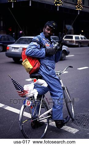 Stock Photo - Man on Bike with USA flag. Fotosearch
