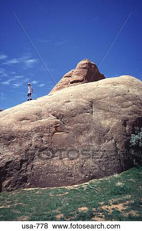 Man on Large Round Rock Utah View Large Photo Image Stock Photo - Man on Large Round Rock Utah. Fotosearch