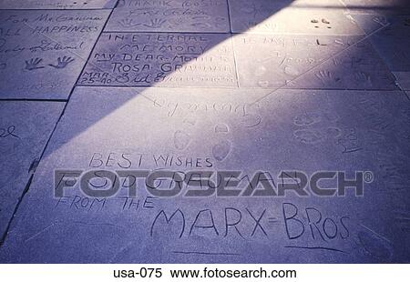 Stock Photography - Names in Pavement at Manns Theatre Hollywood USA. Fotosearch