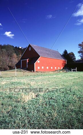 Stock Image - Red Barn in a Field New Hampshire. Fotosearch