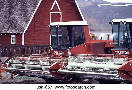 Stock Photo - Two Harvesters in Farm Yard. Fotosearch
