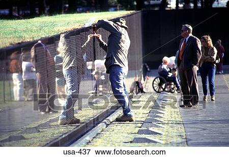 Veteran Rubbing Names at Memorial Washington D. C. View Large Photo Image Stock Photo - Veteran Rubbing Names at Memorial Washington D. C.. Fotosearch