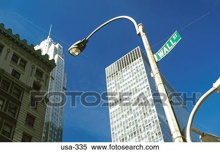 Wall Street Sign on Lamppost New York City USA View Large Photo Image Stock Photography - Wall Street Sign on Lamppost New York City USA. Fotosearch