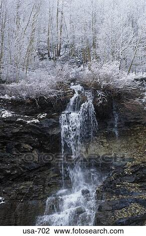 Stock Image - Waterfall in the Rockies Colorado. Fotosearch
