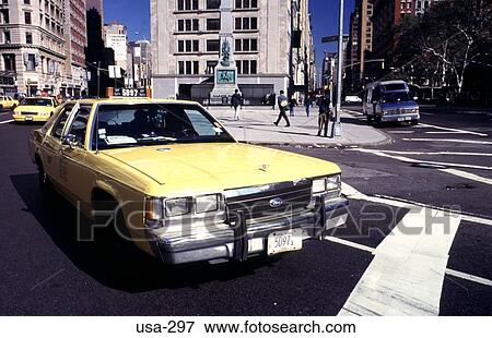 Stock Photo - Yellow Taxi on Fifth Avenue Manhattan New York. Fotosearch
