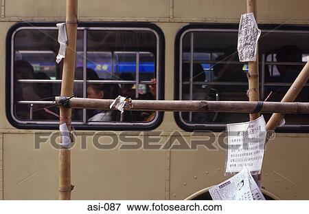 Stock Photo - Bamboo Scafold and Bus Hong Kong. Fotosearch