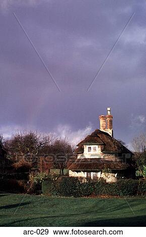 Blaise Dell Thatched Cottage Britain UK View Large Photo Image Stock Photo - Blaise Dell Thatched Cottage Britain UK. Fotosearch