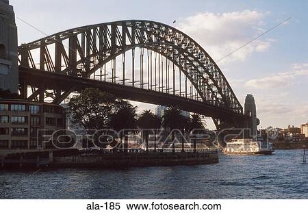 Stock Photography - Boat Passing under Sydney Harbour Bridge Australia. Fotosearch