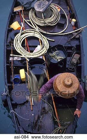 Picture - Boat Woman Casting Rope Shantin Hong Kong. Fotosearch