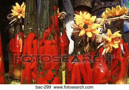 Stock Photo - Chillies in Oil Flasks Australia. Fotosearch