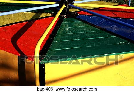 Stock Photograph - Colourful Playground Roundabout. Fotosearch