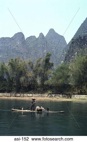 Stock Image - Cormorant Fisherman on the Li River Gulin China. Fotosearch
