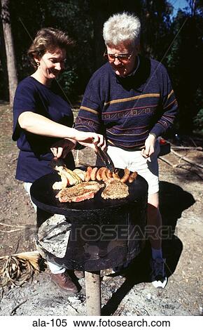 Couple using Barbecue Mapleton Falls Australia View Large Photo Image Stock Photography - Couple using Barbecue Mapleton Falls Australia. Fotosearch