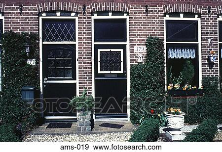 Stock Photo - Front of Brick Houses Amsterdam. Fotosearch