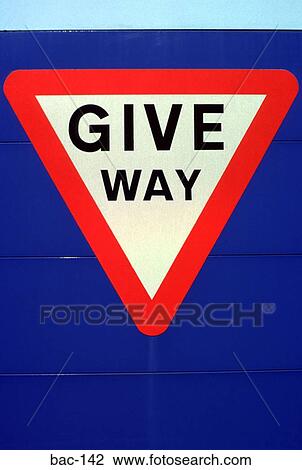 Stock Image - Give Way Sign on Blue Background. Fotosearch