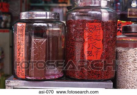 Stock Image - Glass Jars Of Seeds Odd Display Hong Kong. Fotosearch