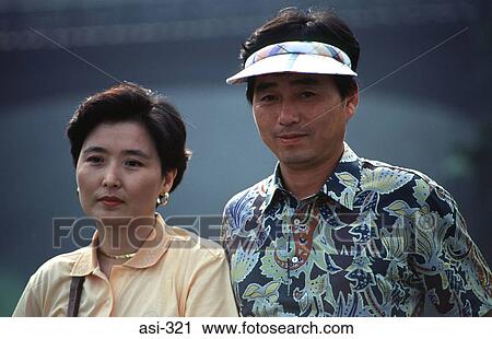 Stock Image - Man and Woman Tokyo Japan Asia. Fotosearch