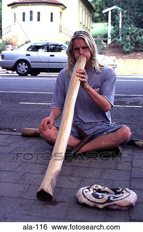 Man Playing Didgeridoo on Eumundi Street Australia View Large Photo Image Stock Photograph - Man Playing Didgeridoo on Eumundi Street Australia. Fotosearch