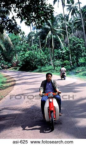 Stock Photography - Man Riding Moped Basilan The Philippines Asia. Fotosearch