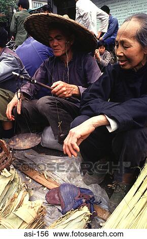 Stock Photograph - Market Traders with Scales. Fotosearch