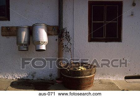 Milk Churns on Farmhouse Wall Austria View Large Photo Image Stock Image - Milk Churns on Farmhouse Wall Austria. Fotosearch