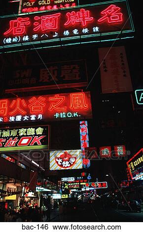 Stock Photograph - Night Street Scene Neon Signs Kowloon. Fotosearch