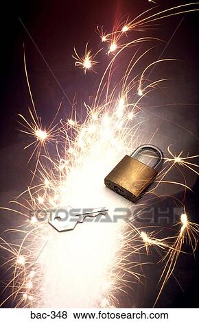 Padlock and Key lit by Firework View Large Photo Image Stock Photo - Padlock and Key lit by Firework. Fotosearch