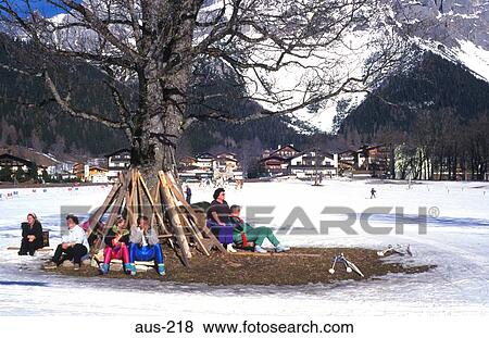 People Sitting Under Tree in Snowy Landscape Austria View Large Photo Image Stock Photo - People Sitting Under Tree in Snowy Landscape Austria. Fotosearch