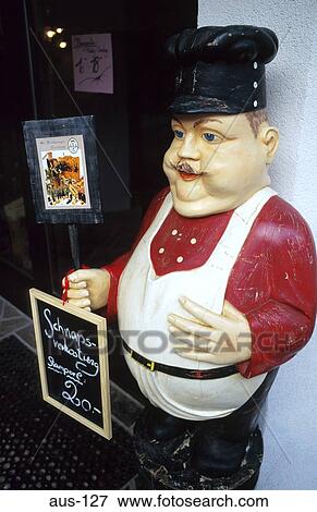 Stock Photo - Plump Chef Statue outside Austrian Restaurant. Fotosearch