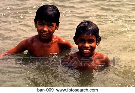 Stock Photo - Portrait of Two Swimming Children Bangladesh Asia. Fotosearch