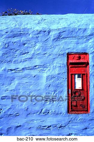 Red Letterbox in Blue Wall England View Large Photo Image Stock Image - Red Letterbox in Blue Wall England. Fotosearch